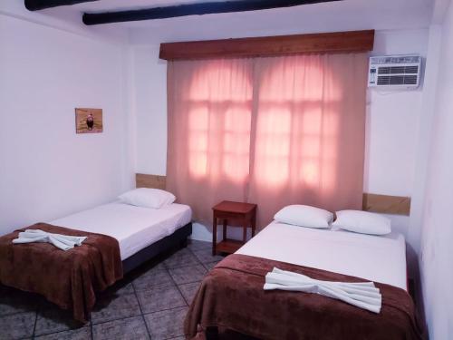 Un ou plusieurs lits dans un hébergement de l'établissement Hotel Crossman