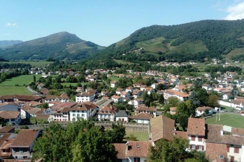 a small town in the mountains with houses at baratzean in Uhart-Cize