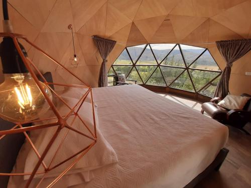 Katil atau katil-katil dalam bilik di Glamping NIDO VERDE