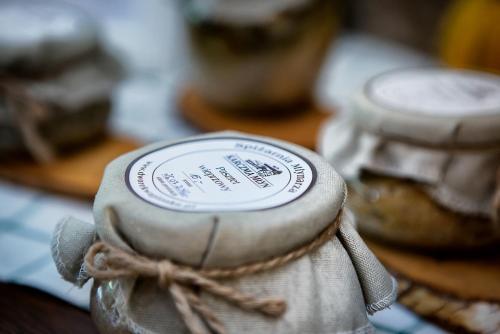 a close up of a jar with a label on it at Hotel Dworek Wapionka in Górzno