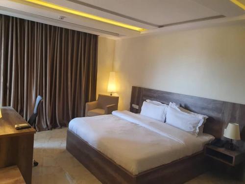 Кровать или кровати в номере Le Masik Hotel