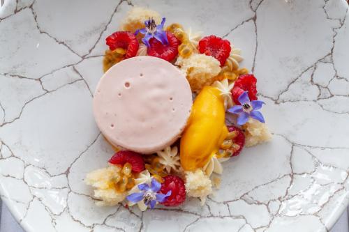 a plate of food with fruit and a treat at The Seaview Hotel And Restaurant in Seaview