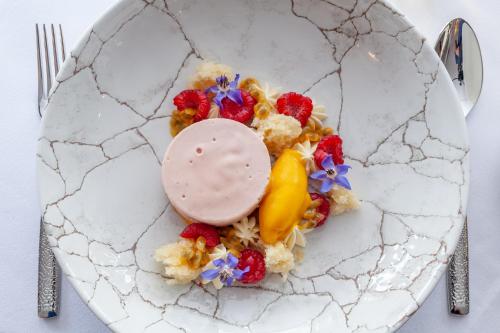 a plate of food with fruit and a dessert at The Seaview Hotel And Restaurant in Seaview