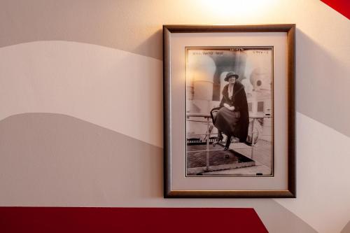 a framed picture of a woman on a wall at The Seaview Hotel And Restaurant in Seaview