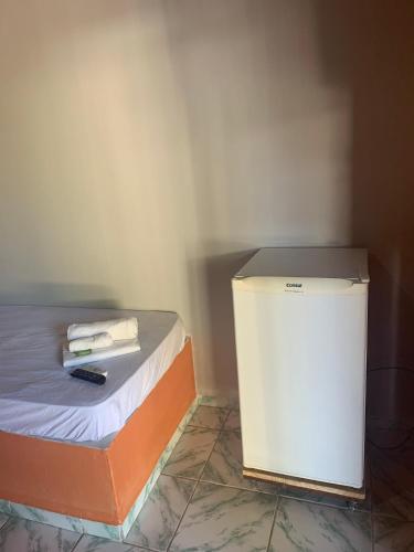 Ένα ή περισσότερα κρεβάτια σε δωμάτιο στο Pousada Sol Dourado