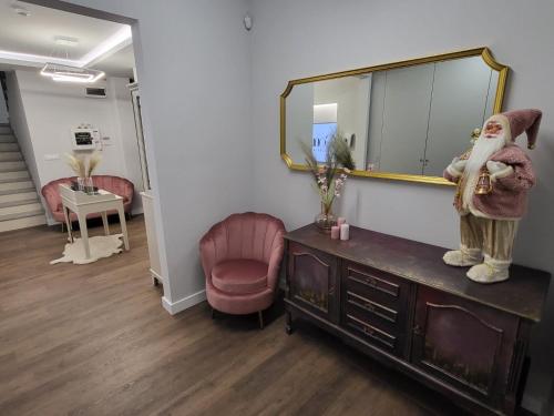 a mirror on top of a dresser in a room at ConnectIN Apartments in Pale