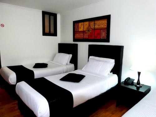 Un ou plusieurs lits dans un hébergement de l'établissement Hotel Radel Bogotá