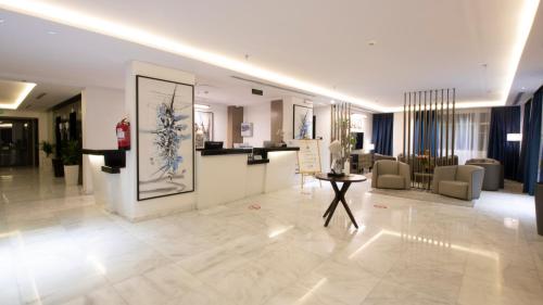 a lobby with a reception desk in a building at Iris Boutique Taif Heart in Taif