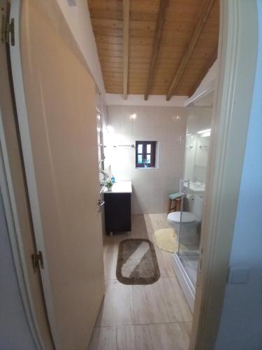 a bathroom with a toilet and a sink at Casa da Esperança in Lousã