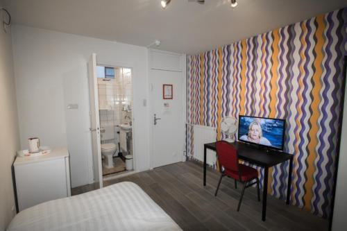 Ένα μπάνιο στο Hotel & bar Royal taste Amsterdam