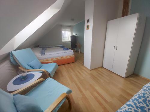 Postel nebo postele na pokoji v ubytování Apartmány Pod Koulí