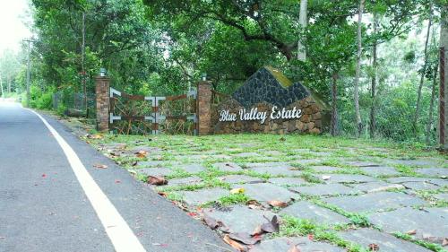 a sign on the side of a road at Blue Valley Estate-12 Acre Forest-Silver Oak-Villa in Yercaud