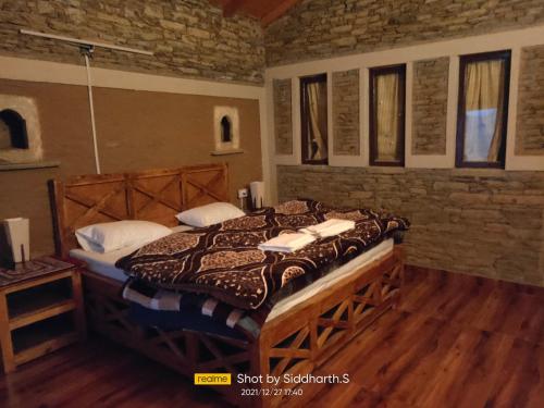 Un pat sau paturi într-o cameră la Meraki Huts