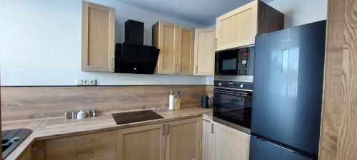 Kuchyň nebo kuchyňský kout v ubytování VLADIMÍRA APARTMÁN TELGÁRT
