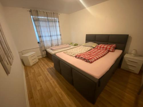 a bedroom with a bed with a blanket on it at Near Tram l 3 Beds l 2 Sleeping Room l Own Parking Space in Bielefeld