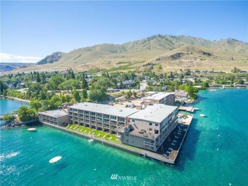 an aerial view of a building in the water at Grandview Lake Chelan- Waterfront View, Pool, Hot tub, Golf, 1 Min To Downtown in Chelan