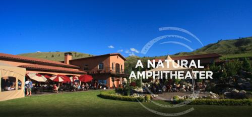a sign for a natural amphitheater next to a resort at Grandview Lake Chelan- Waterfront View, Pool, Hot tub, Golf, 1 Min To Downtown in Chelan