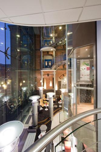a view of a building with a table and chairs at Novotel Cardiff Centre in Cardiff