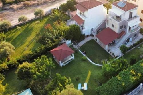 an aerial view of a house with a large yard at Maria's Luxury Apartment in Kassandria