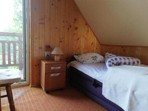 Krevet ili kreveti u jedinici u okviru objekta Dulakówka - domek na każdą pogodę