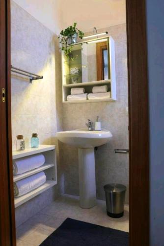 a bathroom with a sink and a mirror at B&B il Faso vicino Zoosafari di Fasano in Fasano