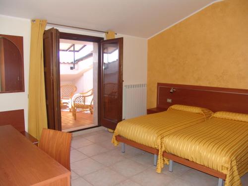 Ένα ή περισσότερα κρεβάτια σε δωμάτιο στο B&B il Tulipano