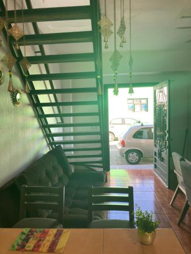 a living room with a couch and a table at La Casa de los Abuelos in Tequila
