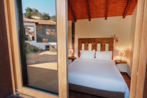 Giường trong phòng chung tại Vila Maria Quinta 13 " Maria Quinta"