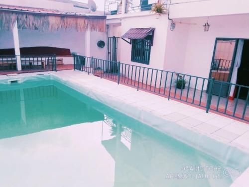 a swimming pool in front of a house at Appartement haut standing avec piscine in Yaoundé