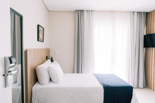 Katil atau katil-katil dalam bilik di Prosper Executive Hotel
