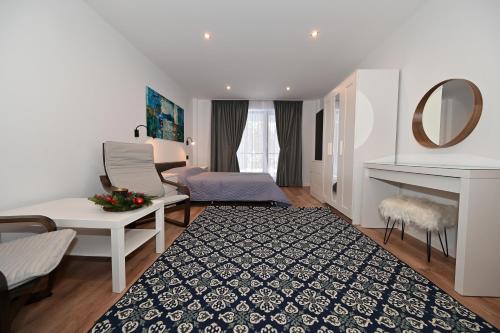 Postel nebo postele na pokoji v ubytování R&B Apartments