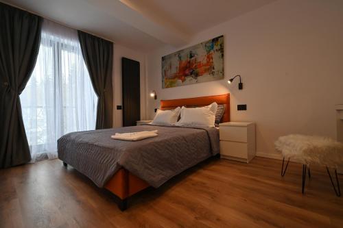 Postel nebo postele na pokoji v ubytování R&B Apartments