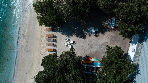 an aerial view of a beach with a boat and tents at Summer Vibes Beach Front in Rasdu