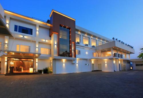 a large building with a lot of windows at night at RAAS Residency in Cochin