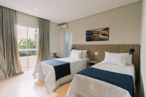Katil atau katil-katil dalam bilik di Prosper Executive Hotel