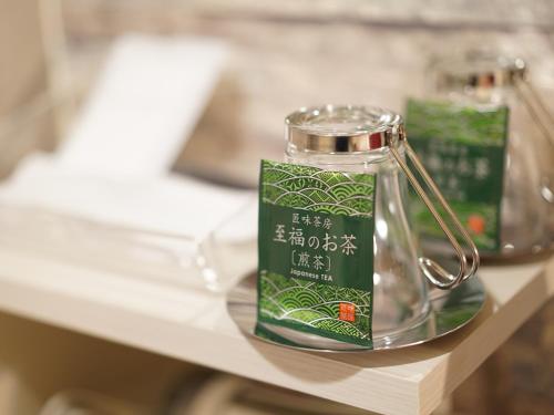 a glass jar sitting on top of a table at Hotel AreaOne Takamatsu City in Takamatsu
