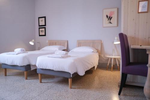 Postel nebo postele na pokoji v ubytování Vicolo Folletto Home