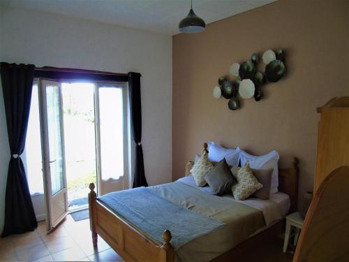 a bedroom with a bed with balloons on the wall at Le Petit Moulin, Ste Soline in Sainte-Soline