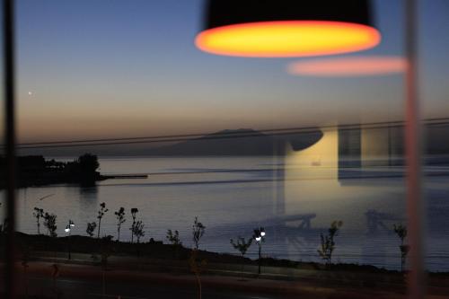 a frisbee is flying over a body of water at Miro Mara Boutique Hotel & Lounge Bar in Edremit