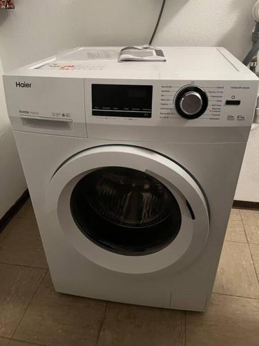 a white washing machine sitting in a room at Cozy Condo, Ski in and Out in Todtnau