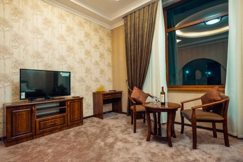 A television and/or entertainment center at Meros Boutique Hotel
