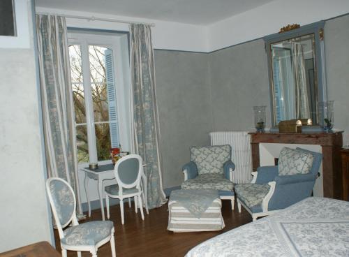 Χώρος καθιστικού στο Chambre d'hôte Moulin de l'Aumonier