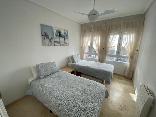 Ліжко або ліжка в номері Villagolf Penthouse