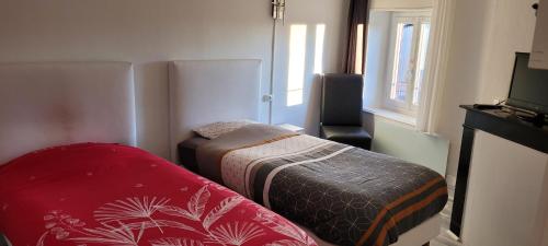 Ένα ή περισσότερα κρεβάτια σε δωμάτιο στο Auberge Gauloise