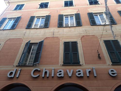 a building with a sign on the side of it at Appartamento Colombo in Chiavari