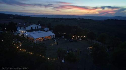 an aerial view of a building at night with lights at Sogno Proibito in Meldola