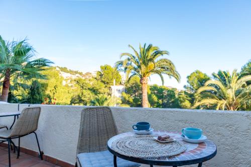 a patio area with a table and chairs at Guesthouse Villa Altea in Altea