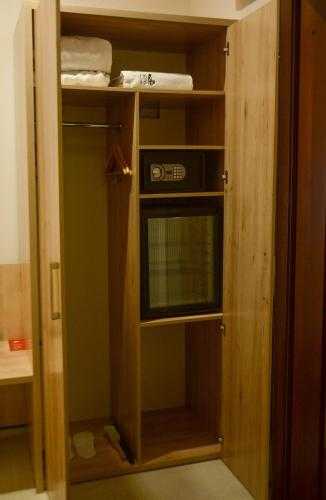 a small closet with a window in a room at Hotel Voskresensky in Sumy