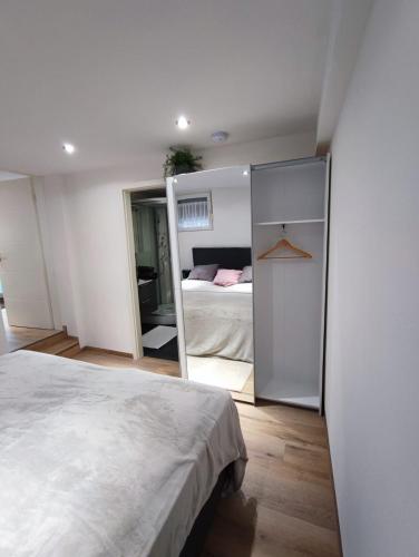 a bedroom with a bed and a mirror at Elida in Burgrieden
