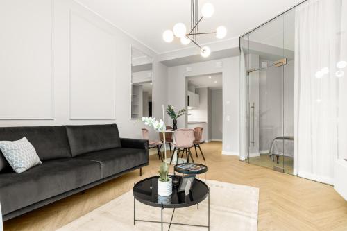 a living room with a couch and a table at Bob W Tallinn City Centre - Ambassador in Tallinn